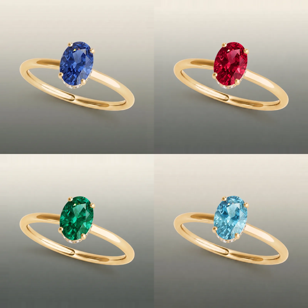 Rania grand engagement ring in yellow gold shown with a sapphire, ruby, emerald and aquamarine