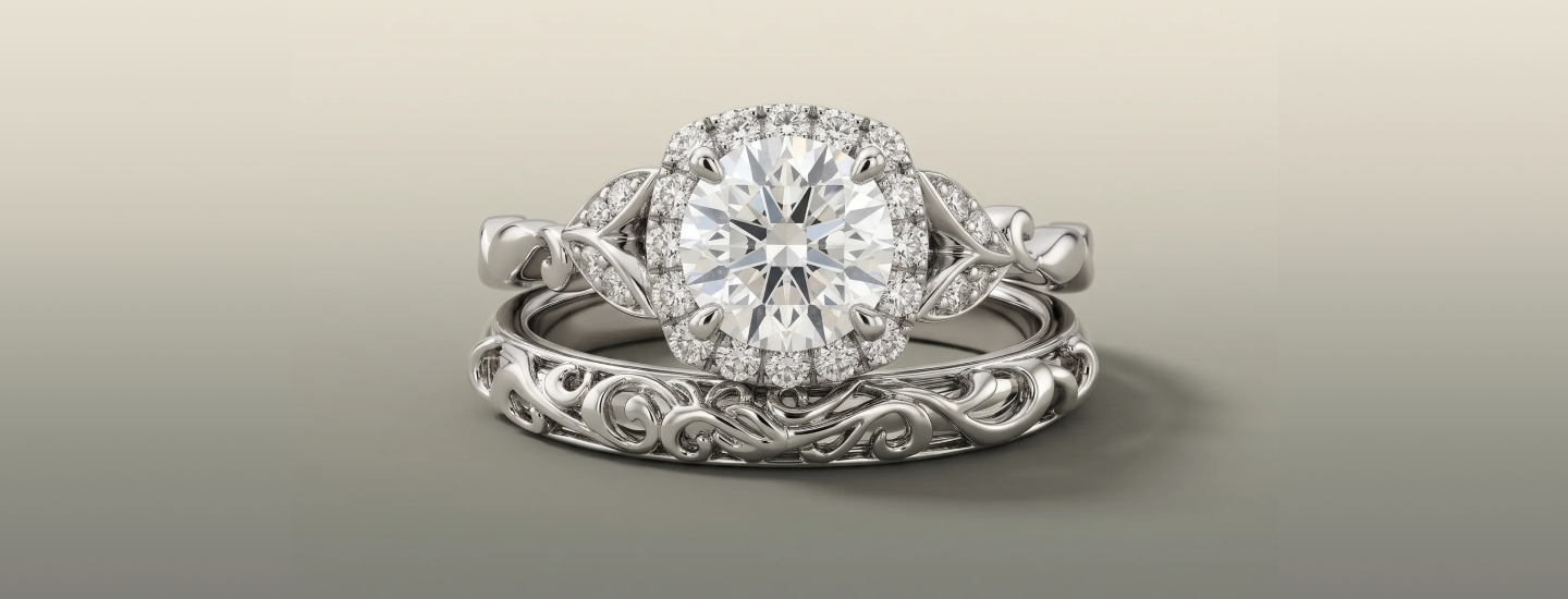 Rentata halo engagement ring nested with the Esme floral wedding band