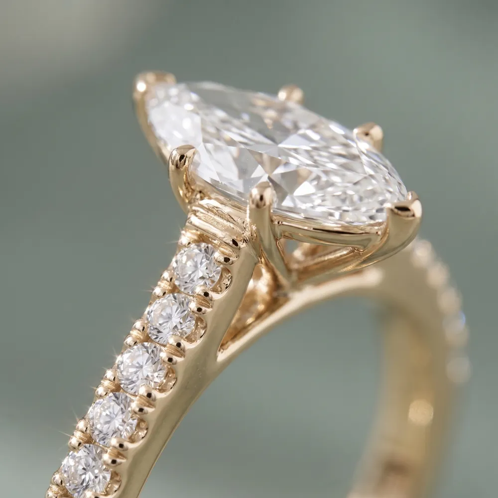 Aida Marquise engagement ring styled for SAMA's Drop Hint feature