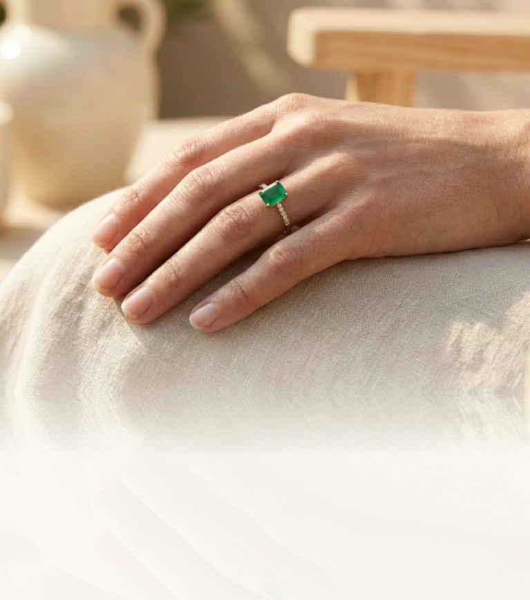 Emerald-cut diamond ring styled in a modern, relaxed setting