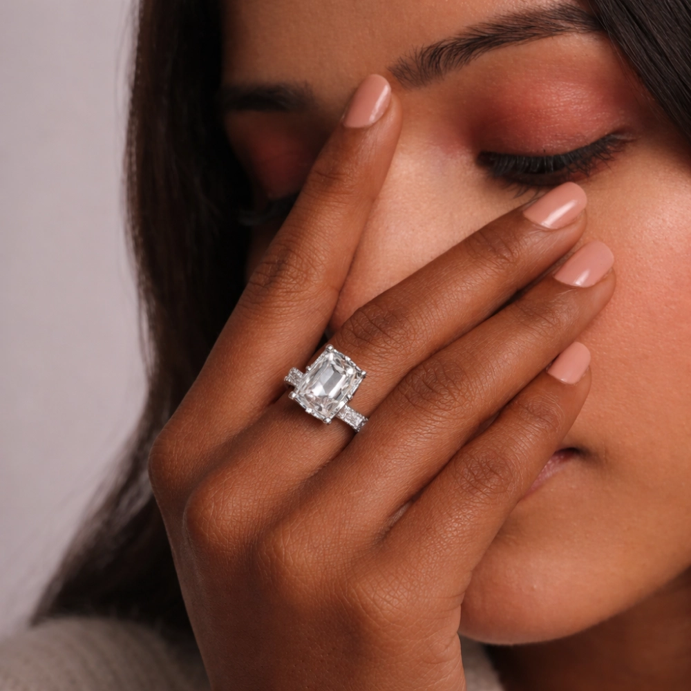 Round diamond ring worn on hand showing realistic carat size appearance