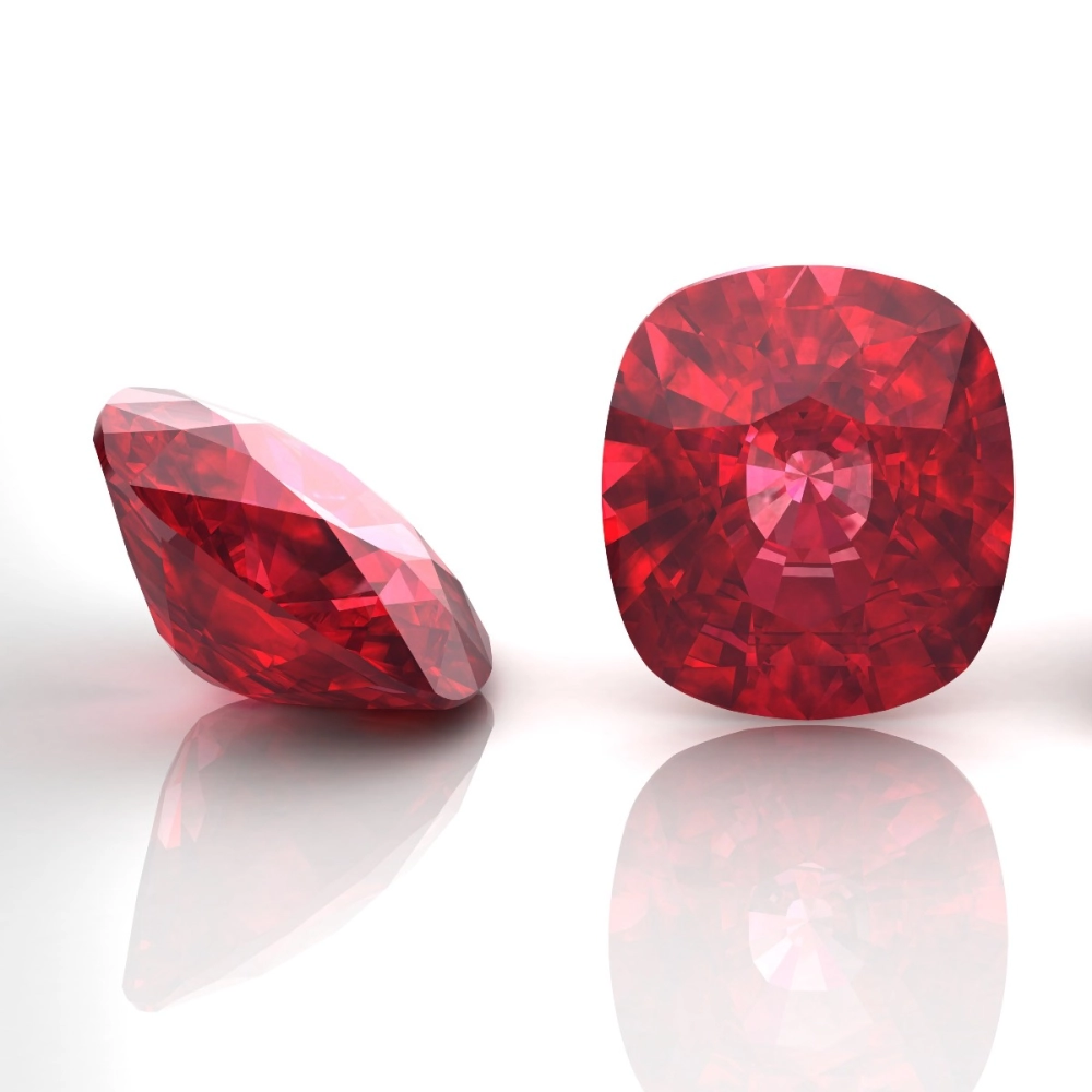 Ruby gemstones photographed to highlight their red color and symbolism of passion, courage, and vitality