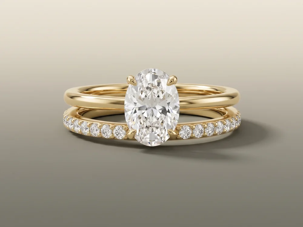 Rania oval engagement ring with the Emily diamond wedding band in yellow gold