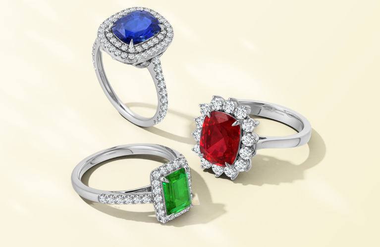 Sapphire, emerald, and ruby engagement rings by SAMA