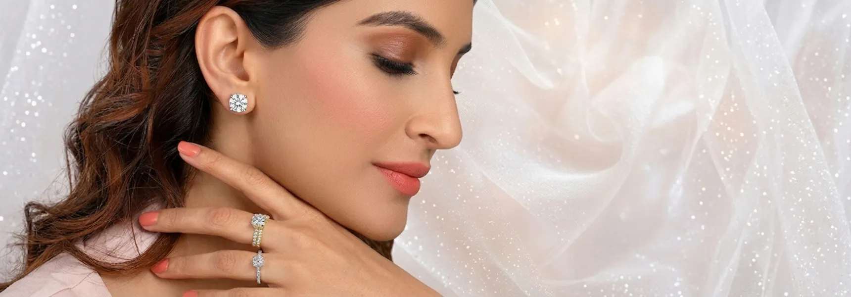 Woman wearing diamond engagement rings — solitaire and pavé settings — showcasing SAMA promo offer.