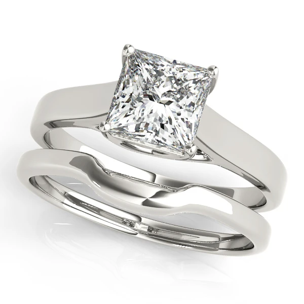 Matching engagement ring and diamond wedding band set in white gold by SAMA