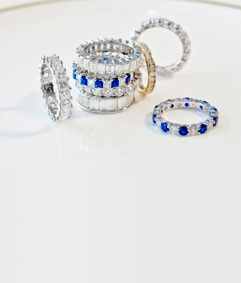Stack of blue sapphire and diamond eternity bands — colorful statement styles by SAMA