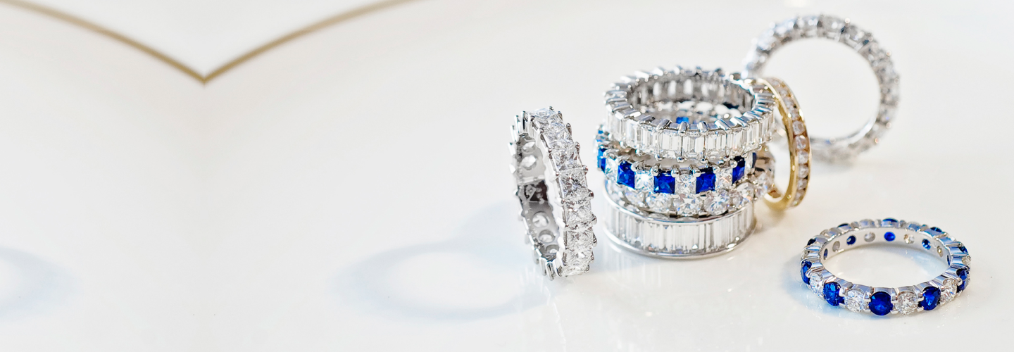 Stack of blue sapphire and diamond eternity bands — colorful statement styles by SAMA