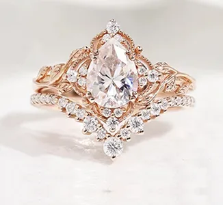 Rose gold marquise diamond engagement ring with nature-inspired leaf detailing by SAMA
