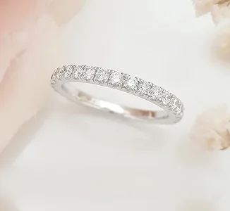 White gold diamond eternity wedding band with pavé-set stones by SAMA